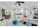 Bright living room with tile flooring, neutral paint, and bar access to the kitchen at 4103 61St E Ave, Bradenton, FL 34203