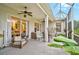Relaxing screened patio with comfortable seating, ceiling fans, and view to a lovely living room at 4103 61St E Ave, Bradenton, FL 34203