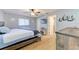 Bedroom features a ceiling fan, hardwood floors, TV, ensuite bathroom, and closet at 4115 2Nd Nw Ave, Bradenton, FL 34209