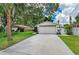 Charming single-story home with a two-car garage and a well-maintained front lawn at 4115 2Nd Nw Ave, Bradenton, FL 34209