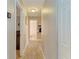 Hallway with tile floors and views to the bedroom, bathroom, and other areas of the home at 4115 2Nd Nw Ave, Bradenton, FL 34209