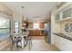 Well-equipped kitchen with wooden cabinets, stainless steel appliances, and a cozy breakfast nook, perfect for casual dining at 4115 2Nd Nw Ave, Bradenton, FL 34209
