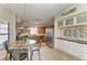 Modern kitchen with wood cabinets, stainless steel appliances, and a round table, ideal for everyday meals and entertaining guests at 4115 2Nd Nw Ave, Bradenton, FL 34209