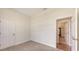 Neutral bedroom with open doorways and neutral carpet at 4274 Tennyson Way, Venice, FL 34293