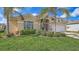 Charming single Gathering home boasts a lush landscaped yard and attached two car garage at 4274 Tennyson Way, Venice, FL 34293