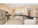 Bright kitchen with granite countertops, stainless steel appliances, and ample cabinet space at 4274 Tennyson Way, Venice, FL 34293