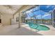 Screened-in pool area with view of the lake at 4274 Tennyson Way, Venice, FL 34293