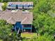 An aerial view captures the home nestled in trees, with a well-manicured landscape at 4500 Chinkapin Dr, Sarasota, FL 34232