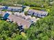 Aerial view of a residential community with well-maintained landscaping and a tranquil pond at 4500 Chinkapin Dr, Sarasota, FL 34232