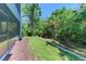 A view of the backyard showing a landscaped yard, offering an outdoor area for recreation and relaxation at 4500 Chinkapin Dr, Sarasota, FL 34232