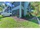 View of the backyard featuring a screened porch and well-maintained landscaping at 4500 Chinkapin Dr, Sarasota, FL 34232