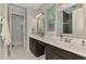 Double sinks and lots of light in this bathroom that features an ensuite bathroom at 4500 Chinkapin Dr, Sarasota, FL 34232