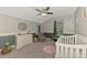 Bright bedroom with a ceiling fan, a rocking chair, and ample natural light, perfect for relaxation at 4500 Chinkapin Dr, Sarasota, FL 34232