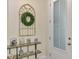 Inviting entryway with stylish decor and ample natural light, and frosted glass door at 4500 Chinkapin Dr, Sarasota, FL 34232