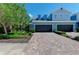 Charming two-story townhome with brick paver driveway and attached two-car garage at 4500 Chinkapin Dr, Sarasota, FL 34232