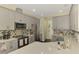 Spacious kitchen boasting ample cabinetry, stainless steel appliances, and a convenient layout at 4500 Chinkapin Dr, Sarasota, FL 34232