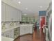 Modern kitchen featuring gray cabinets, stainless steel appliances and an open concept design at 4500 Chinkapin Dr, Sarasota, FL 34232