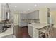 Bright kitchen with gray cabinets, stainless steel appliances, and a breakfast bar for casual dining at 4500 Chinkapin Dr, Sarasota, FL 34232