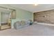 Open floor plan living room with textured wall, carpet, and view to upstairs hallway at 4500 Chinkapin Dr, Sarasota, FL 34232