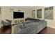 Spacious living room with dark wood floors, comfortable seating, and ample natural light at 4500 Chinkapin Dr, Sarasota, FL 34232