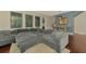 Inviting living room features an oversized sectional sofa, hardwood floors, and modern decor at 4500 Chinkapin Dr, Sarasota, FL 34232