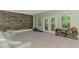 Spacious living room area with textured wall, neutral carpet and walk out to patio at 4500 Chinkapin Dr, Sarasota, FL 34232