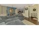 Inviting living room with a plush gray sofa, hardwood floors, and an open floor plan at 4500 Chinkapin Dr, Sarasota, FL 34232