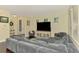 Bright living room with a large sectional sofa, entertainment center, and inviting decor at 4500 Chinkapin Dr, Sarasota, FL 34232