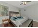 Comfortable main bedroom with a ceiling fan and wood floors and a view of the windows at 4500 Chinkapin Dr, Sarasota, FL 34232