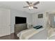 Spacious main bedroom with a ceiling fan, wood floors, and ensuite bathroom access at 4500 Chinkapin Dr, Sarasota, FL 34232