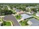 Expansive aerial view of a charming neighborhood showcasing lush green lawns and mature trees at 4804 Jacaranda Heights Dr, Venice, FL 34293