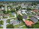 Aerial view of homes and the surrounding community, with a view to the Gulf beyond at 4804 Jacaranda Heights Dr, Venice, FL 34293