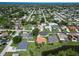 Aerial view of a spacious neighborhood with lush landscaping and mature trees at 4804 Jacaranda Heights Dr, Venice, FL 34293
