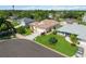 Beautiful aerial view of a well-maintained home showcasing its lush landscaping and proximity to nature at 4804 Jacaranda Heights Dr, Venice, FL 34293