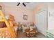 Charming bedroom featuring bunk beds and a cozy seating area, perfect for or guests at 4804 Jacaranda Heights Dr, Venice, FL 34293