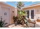 Courtyard detail with lounge chairs, lush foliage, and privacy, bathed in natural light and covered for protection at 4804 Jacaranda Heights Dr, Venice, FL 34293