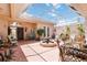 Inviting courtyard with a covered patio, perfect for outdoor entertaining and relaxation with a fountain at 4804 Jacaranda Heights Dr, Venice, FL 34293