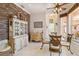 Cozy dining area with tiled flooring, glass top table and decorative accents throughout at 4804 Jacaranda Heights Dr, Venice, FL 34293