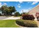 Well-maintained home exterior with mature trees and manicured landscaping at 4804 Jacaranda Heights Dr, Venice, FL 34293