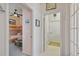 Inviting hallway showcasing access to a cozy bedroom, offering a glimpse into the home's layout at 4804 Jacaranda Heights Dr, Venice, FL 34293
