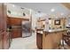 Well-equipped kitchen with stainless steel appliances, granite countertops, and wood cabinetry at 4804 Jacaranda Heights Dr, Venice, FL 34293