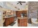 Stylish kitchen featuring granite countertops, stainless steel appliances, and a stone accent wall at 4804 Jacaranda Heights Dr, Venice, FL 34293
