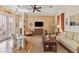 Beautifully decorated living room featuring wood floors, tasteful furniture, and ample natural light at 4804 Jacaranda Heights Dr, Venice, FL 34293