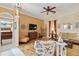 Comfortable living room with wood floors, beach themed decor, and lots of seating at 4804 Jacaranda Heights Dr, Venice, FL 34293