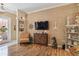 Cozy living area with wood-style floors, decorative shelving, and unique accents at 4804 Jacaranda Heights Dr, Venice, FL 34293