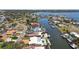 This aerial showcases waterfront homes along a canal, each featuring private docks and access to the bay at 4829 Commonwealth Rd, Palmetto, FL 34221