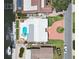 Aerial view of waterfront property featuring a pool, private dock, canal access and a well-maintained yard at 4829 Commonwealth Rd, Palmetto, FL 34221