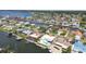 This aerial view shows waterfront homes with docks, perfect for boaters, with easy access to the bay and beautiful blue waters at 4829 Commonwealth Rd, Palmetto, FL 34221
