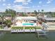 Aerial view featuring a home with a pool, waterfront access, and a boat dock, ideal for relaxing and boating at 4829 Commonwealth Rd, Palmetto, FL 34221