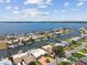 Stunning aerial view of waterfront homes with private docks on canals leading to the bay and partial views of the Intracoastal at 4829 Commonwealth Rd, Palmetto, FL 34221